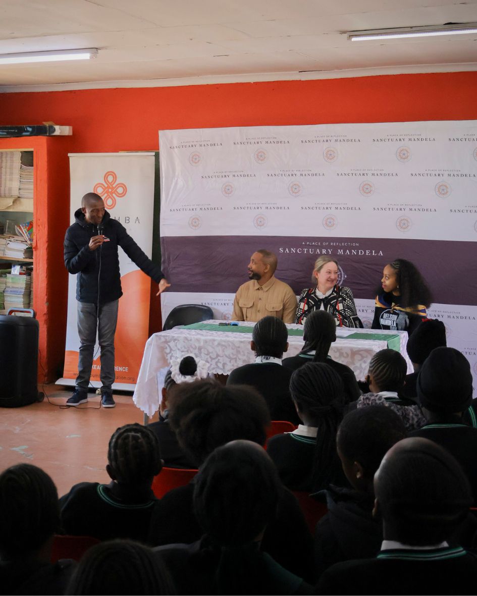Foundation representative speaking to the girls